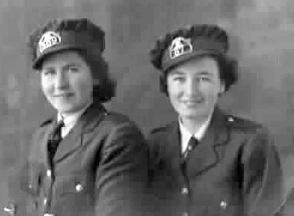 Mary Mathews and Peggy Edwards in their clippie uniforms.