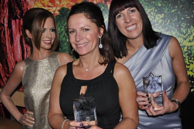 Helen Clark, left, and Lisa Gregory at the Berry Recruitment awards night with a waxwork of Cheryl Fernandez-Versini