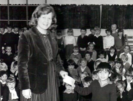 Money raised for the Ethiopian famine at Hart Plain School is handed over by 'the naughtiest boy in the school'