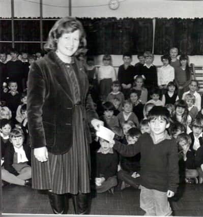 Money raised for the Ethiopian famine at Hart Plain School is handed over by 'the naughtiest boy in the school'