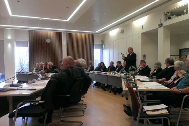 Ukip councillor John Perry brandishes a banana and a cucumber during a Havant Borough Council meeting last night Picture: Jeff Travis
