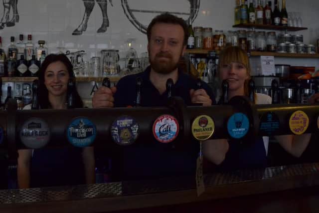 From left, Jess Kaqorri, Steffan Jones and Laura McCallum at Meat and Barrel, in Palmerston Road, Southsea. Picture: RaphaÃ«lle PÃ©rez
