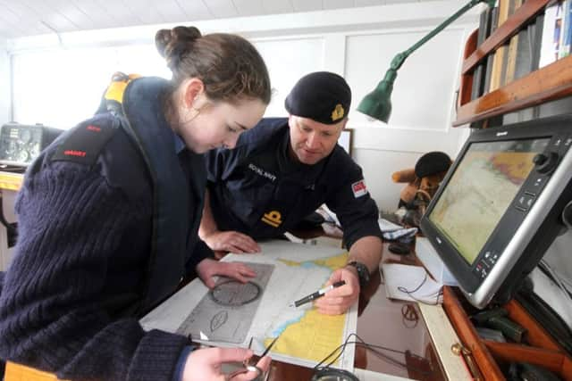 MAPPING A cadet and the instructor Lt Paul Lane plot Medusas position on the chart