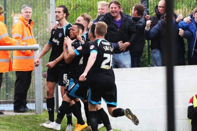 Christian Burgess celebrates his goal at Dagenham & Redbridge