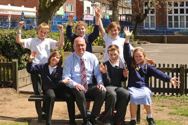 Craneswater Junior School headteacher David Jones pictured with pupils in 2013, after a good Ofsted report