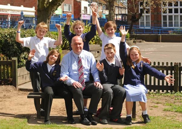 Craneswater Junior School headteacher David Jones pictured with pupils in 2013, after a good Ofsted report