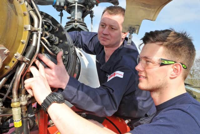 SKILLS Petty Officer James Callaghan provides some technical guidance to Phillip Broodbank, during the mechanical training workshops at HMS Sultan Picture: L(Phot) Dave Jenkins