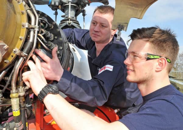 SKILLS Petty Officer James Callaghan provides some technical guidance to Phillip Broodbank, during the mechanical training workshops at HMS Sultan 				Picture: L(Phot) Dave Jenkins
