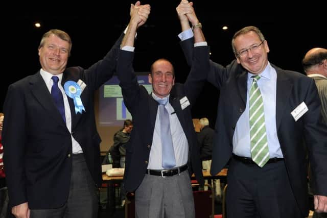 03/05/12 CBConservative party winning candidate, David Whittingham rewceives support from (left), councillor Sean Woodwasupporters applause during the local election count for Fareham at Ferneham Hall.Picture: Ian Hargreaves 1 ENGPPP00120120405024925