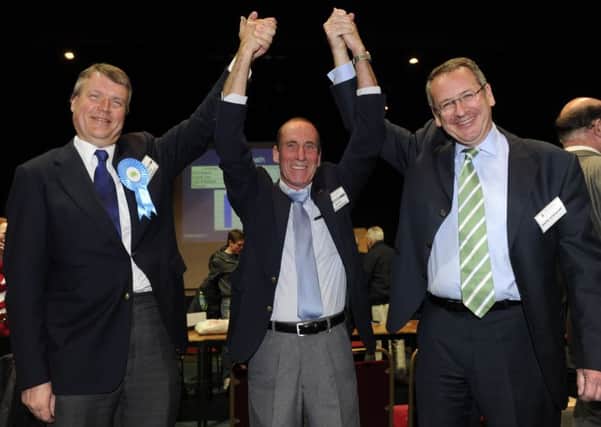 03/05/12 CB

Conservative party winning candidate, David Whittingham rewceives support from (left), councillor Sean Woodwasupporters applause during the local election count for Fareham at Ferneham Hall.
Picture: Ian Hargreaves 1 ENGPPP00120120405024925
