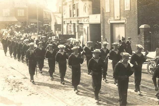 Sailors marching through Portsmouth on the way to the cemetery