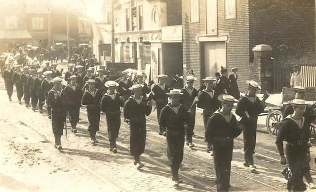 Sailors marching through Portsmouth on the way to the cemetery