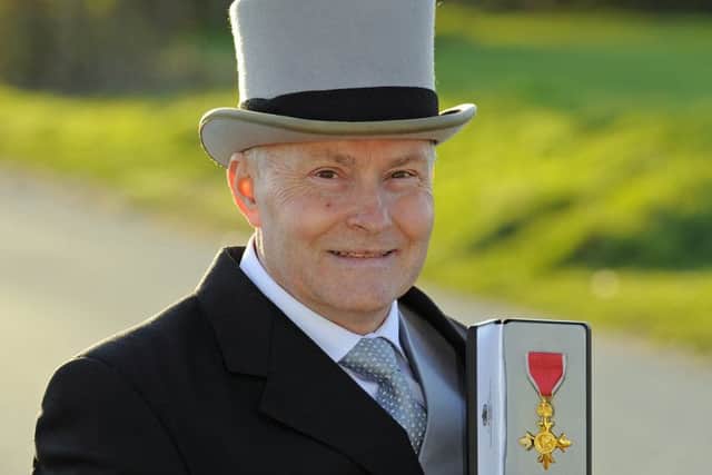 Paul Smith receives his OBE medal for his services to charity Picture: Malcolm Wells