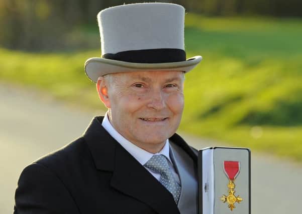 Paul Smith receives his OBE medal for his services to charity Picture: Malcolm Wells