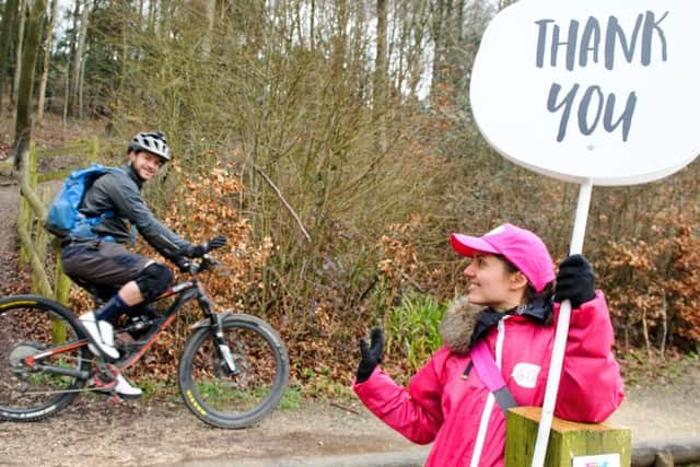 Paris Everett welcomes cyclist Richard Wilkins to Queen Elizabeth Country Park