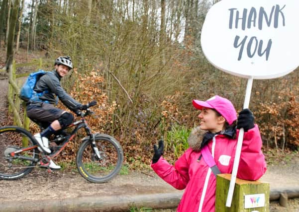 Paris Everett welcomes cyclist Richard Wilkins to Queen Elizabeth Country Park