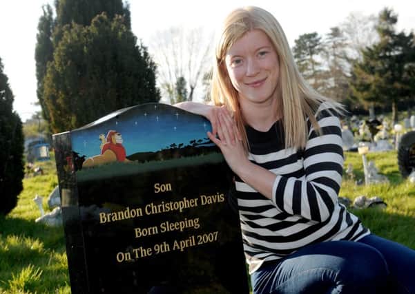 Lucy Maidens (29) next to her son Brandon Davis's grave at Waterlooville Cemetery. 

Picture: Sarah Standing (160615-2875)