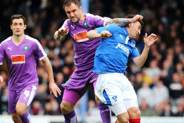 Gary Roberts is stopped by a cynical challenge from Peter Hartley. Picture: Joe Pepler