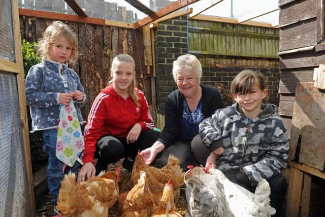From left, Layla Morgan (four), Olivia West (12), with Shirley Arbon who runs the centre and Sarah Dowse (nine).
Picture: Ian Hargreaves (160576-2)