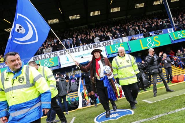 'Pompey pirate' Craig Bryden leads out the Pompey and Plymouth teams at Fratton Park Picture: Joe Pepler