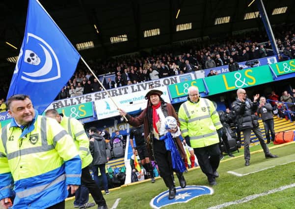 'Pompey pirate' Craig Bryden leads out the Pompey and Plymouth teams at Fratton Park Picture: Joe Pepler