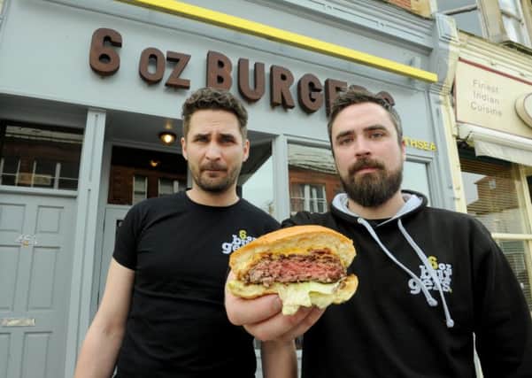 Piotr Mientkiewic, left, and James Baldry 
at 6 oz Burgers in Southsea