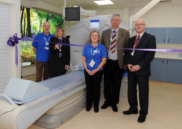 The new CT scanner unveiled at Queen Alexandra Hospital can perform a chest scan in just two seconds.

From left, League of Friends Peter Gorvin, superintendent of CT and MR scanning Nicki Wragg,  Jan Satchell from the League of Friends, clinical director of diagnostic imaging services Nigel Cowan and Mark Foxall from Toshiba

Picture: Sarah Standing (160319-2683)