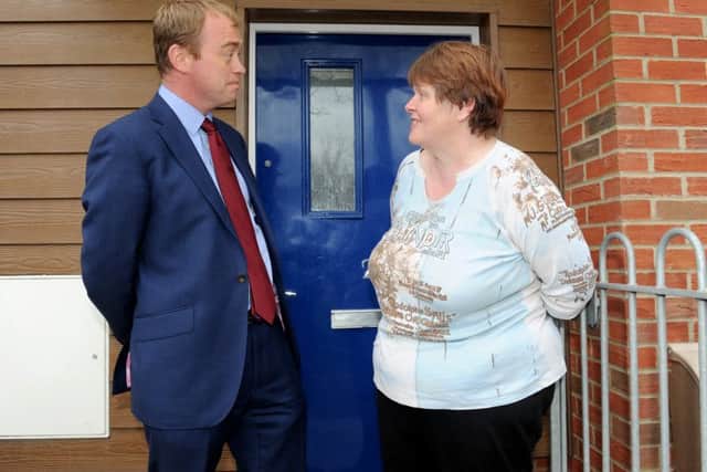 Liberal Democrat leader Tim Farron speaks to Josephine Reeve outside her home in Portsmouth Picture: Sarah Standing (160623-3700)