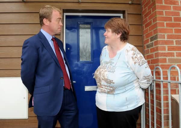 Liberal Democrat leader Tim Farron speaks to Josephine Reeve outside her home in Portsmouth Picture: Sarah Standing (160623-3700)