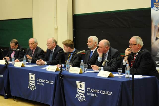 Police and crime commissioner candidates, from left, Richard Adair, Simon Hayes, Don Jerrard, Michael Lane, Robin Price and Steve Watts, with, centre, St John's College head boy David Evans who chaired the hustings Picture: Sarah Standing (160625-3865)