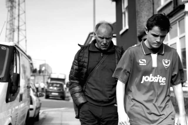 One of Andrew Malbon's images, showing a father and son walking home after a Pompey match
