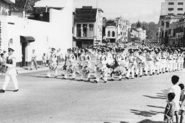 Royal H Regiment Band and Corps of Drums marching through Kuala Lumpur, 1956