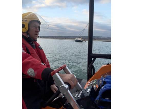Gafirs coxswain Brian Pack mans Gosport lifeboat while crew member Phil Butler assists the stricken vesse