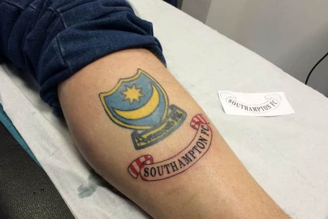 Pompey fan James Sullivan has had a Southampton FC banner tattooed underneath his Portsmouth FC crest inking for charity

Picture: Kimberley Barber