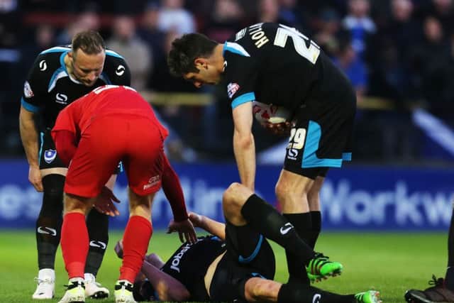 Adam Webster lies stricken on the Bootham Crescent turf. Picture: Joe Pepler