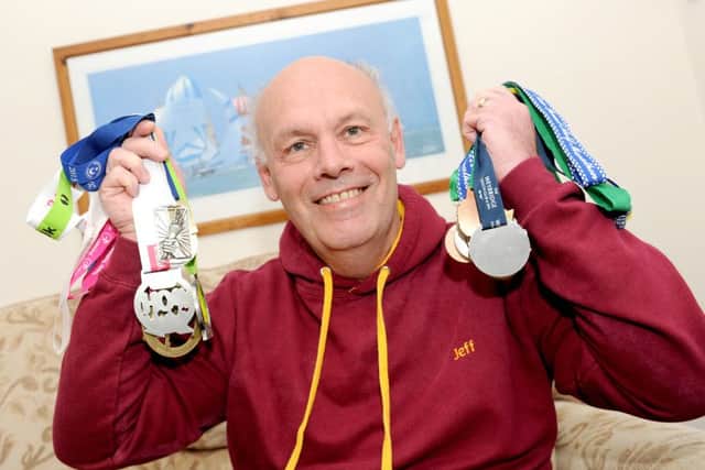 Jeff Clark from Portchester, with some of the medals he has earned at running events Picture: Sarah Standing (160607-1965)
