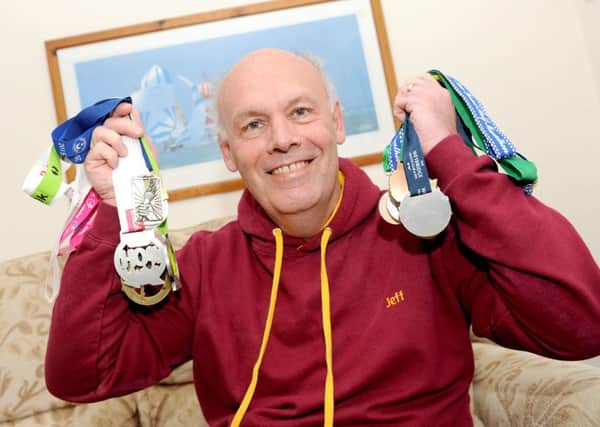 Jeff Clark from Portchester, with some of the medals he has earned at running events Picture: Sarah Standing (160607-1965)