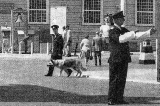 A member of the Admiralty Constabulary directs traffic at the Main Gate (now Victory Gate) Portsmouth Dockyard. (John Taylor collection)