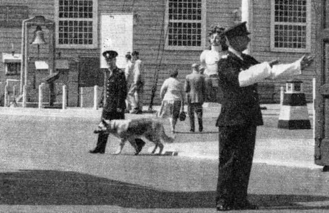 A member of the Admiralty Constabulary  directs traffic at the  Main Gate (now Victory Gate) Portsmouth Dockyard. (John Taylor collection)