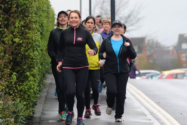 Verity Wright with her running group as they set off on a three-mile run