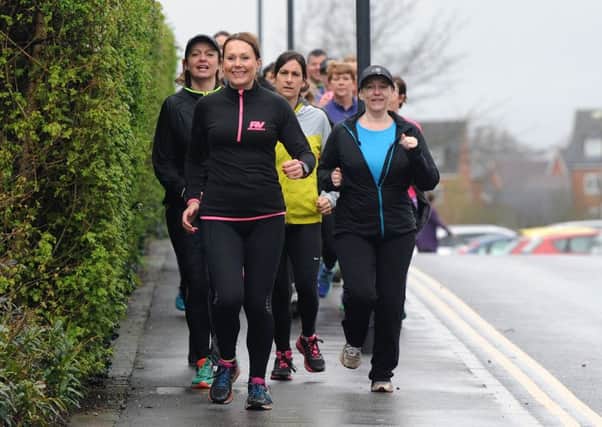 Verity Wright with her running group as they set off on a three-mile run