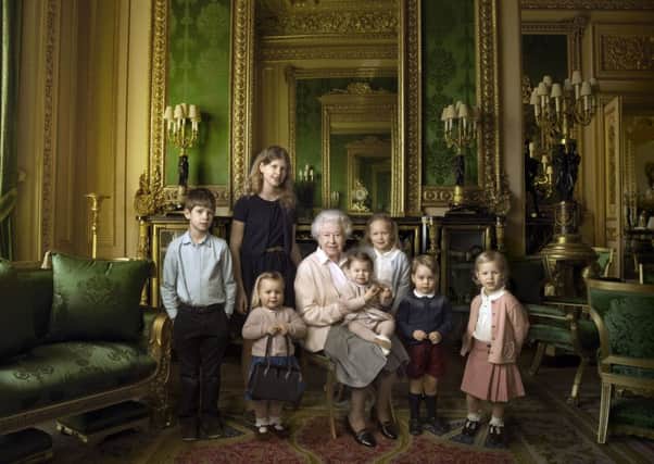 This official photograph, released by Buckingham Palace to mark her 90th birthday, shows Queen Elizabeth II with her five great-grandchildren and her two youngest grandchildren in the Green Drawing Room, part of Windsor Castle's semi-State apartments. The children are: James, Viscount Severn (left), 8, and Lady Louise (second left), 12, the children of The Earl and Countess of Wessex;  Mia Tindall (holding The Queen's handbag), the two year-old-daughter of Zara and Mike Tindall; Savannah (third right), 5, and Isla Phillips (right), 3, daughters of The Queen's eldest grandson Peter Phillips and his wife Autumn; Prince George (second right), 2, and in The Queen's arms and in the tradition of Royal portraiture, the youngest great-grandchild, Princess Charlotte (11 months), children of The Duke and Duchess of Cambridge. Â© 2016 Annie Leibovitz / PA Wire