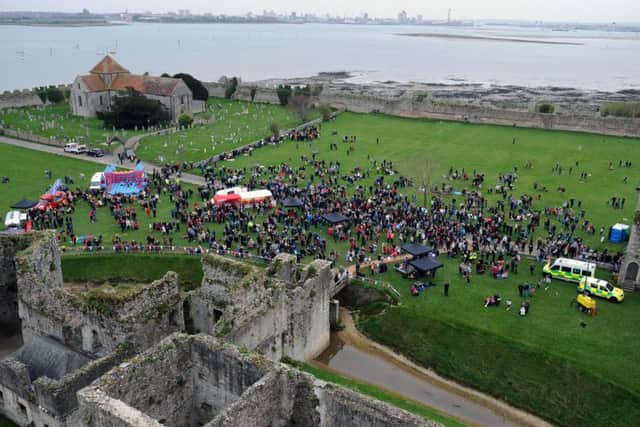 Crowds watch the beacon being lit in Portchester 

Picture: Sarah Standing (160634-4586)