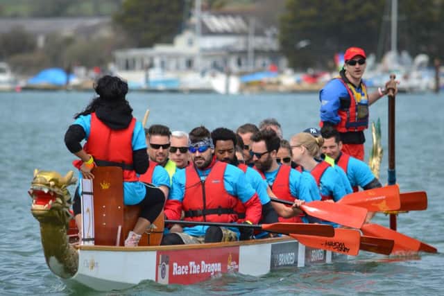 In the front of the boat are Keith Duffy and Shane Lynch from Boyzone, with Isle of Wight Festival organiser
John Giddings and actor Nicholas Pinnock
in the next row