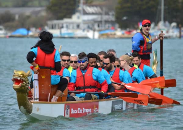 In the front of the boat are Keith Duffy and Shane Lynch from Boyzone, with Isle of Wight Festival organiser 
John Giddings and actor Nicholas Pinnock

in the next row
