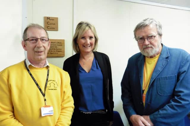 Harry Ansell, from Gosport Men's Shed, with Caroline Dinenage and founder of the group Martin CorrickThe group has opened bigger premises