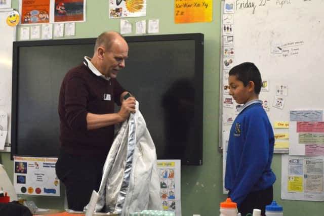 Foundry worker Ian Connor, Senior Process Chemist Selex ES with pupil Roman Marabese
Picture: David George