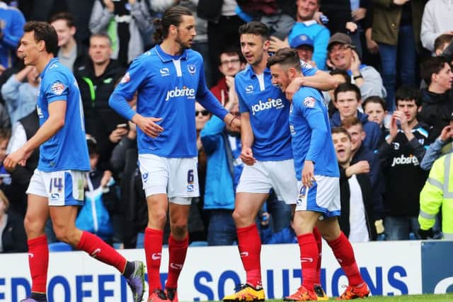 Conor Chaplin is congratulated after scoring Pompey's winner against Wycombe Picture: Joe Pepler