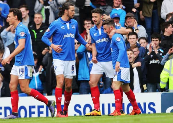 Conor Chaplin is congratulated after scoring Pompey's winner against Wycombe Picture: Joe Pepler