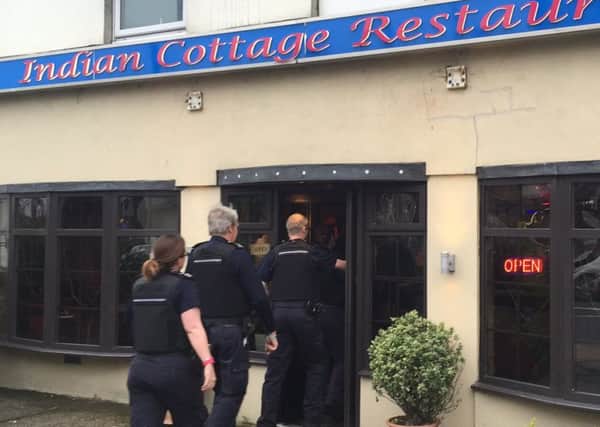 An immigration raid on the Indian Cottage curry house in West Street, Fareham on Friday Picture: Tom Cotterill